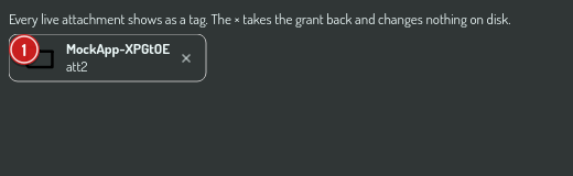 The attachment tag row above the input, with the close affordance on each tag